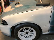 Test painted the fender. Rattle can white. I think this will do. Also note the piece MIA off the bumper. This will stay. I can always paint a replacement easily. 
Only concern with the “spray bomb” is the lack of UV longevity. But I can’t pass up a $20 paint job. And this thing will be garaged most of the time with my primary vehicle. Perks of a company daily! Going to need to re sand a few areas and lay high build primer. But this will work for a while.