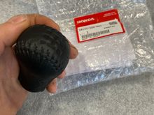 I bought a new ITR shift knob just before they were discontinued, I had the red stiching removed and had it redone with black- so as to match the original EM1 shift knob (that has been long discontinued). I also bought the matching shift boot which lets the knob click in. 