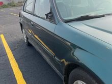 Front right, doesn't really show a whole lot other than that the mirror is gone. also shows that the car is now misshaped. 