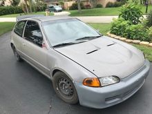 The outside looks nice. Dents and dings, some weatherstripping missing on the passenger window. The wheels didn't pop yet so that's good for what they are and the carbon fiber hood with it's scoops is causing a misery in the bay