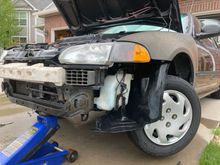 I thought it would be a lot easier to drop the windshield washer reservoir out of the way with the bumper skin off, so here we go!