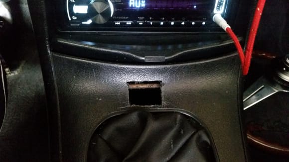 Just got bored and started making a hole in my center console.