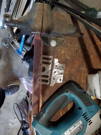 Ground all the paint off, and cut it in half, saving the part with the slots that we needed.