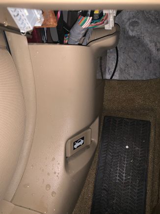 Water on drivers side where the gas cap release lever is located