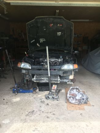 Car sitting with the old transmission out and the new one ready. Just waiting on a clutch and fly wheel. Car also getting new front end parts like my hatch lots to do!