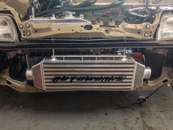 Mounting a new smaller go-autoworks intercooler so I can do a back door style piping. Mainly doing this to help push the intercooler closet to the radiator and allow me to bring back some fog lights