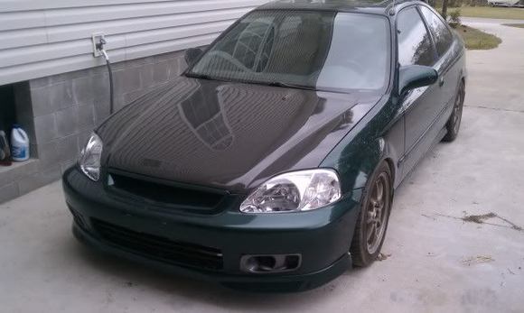 Hood before crack, wheels before they were powder coated bronze burst and headlights before HID retrofit. Will update with a new pic soon