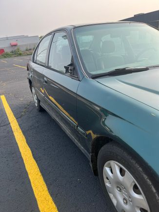 Front right, doesn't really show a whole lot other than that the mirror is gone. also shows that the car is now misshaped. 