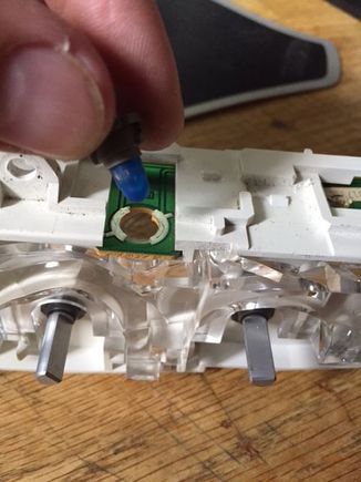 use a flathead screwdriver to gently twist the bulb, then pull it out