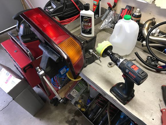 Polishing the lights before installing them.