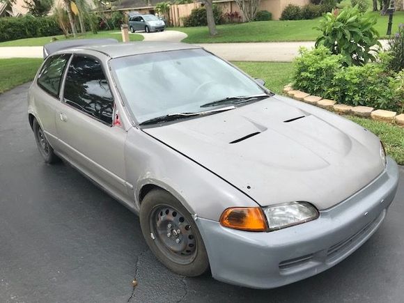 The outside looks nice. Dents and dings, some weatherstripping missing on the passenger window. The wheels didn't pop yet so that's good for what they are and the carbon fiber hood with it's scoops is causing a misery in the bay