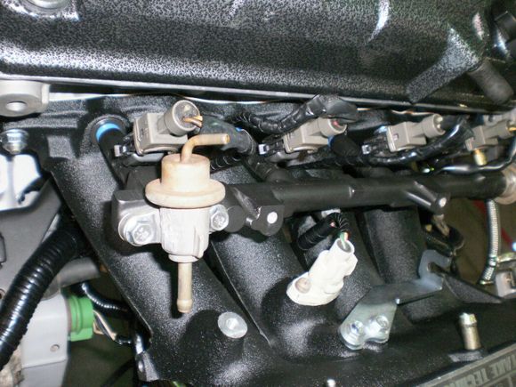 stock fuel rail powder coated along with alt bracket, engine mount brackets, coolant cross over tube and T stat.
