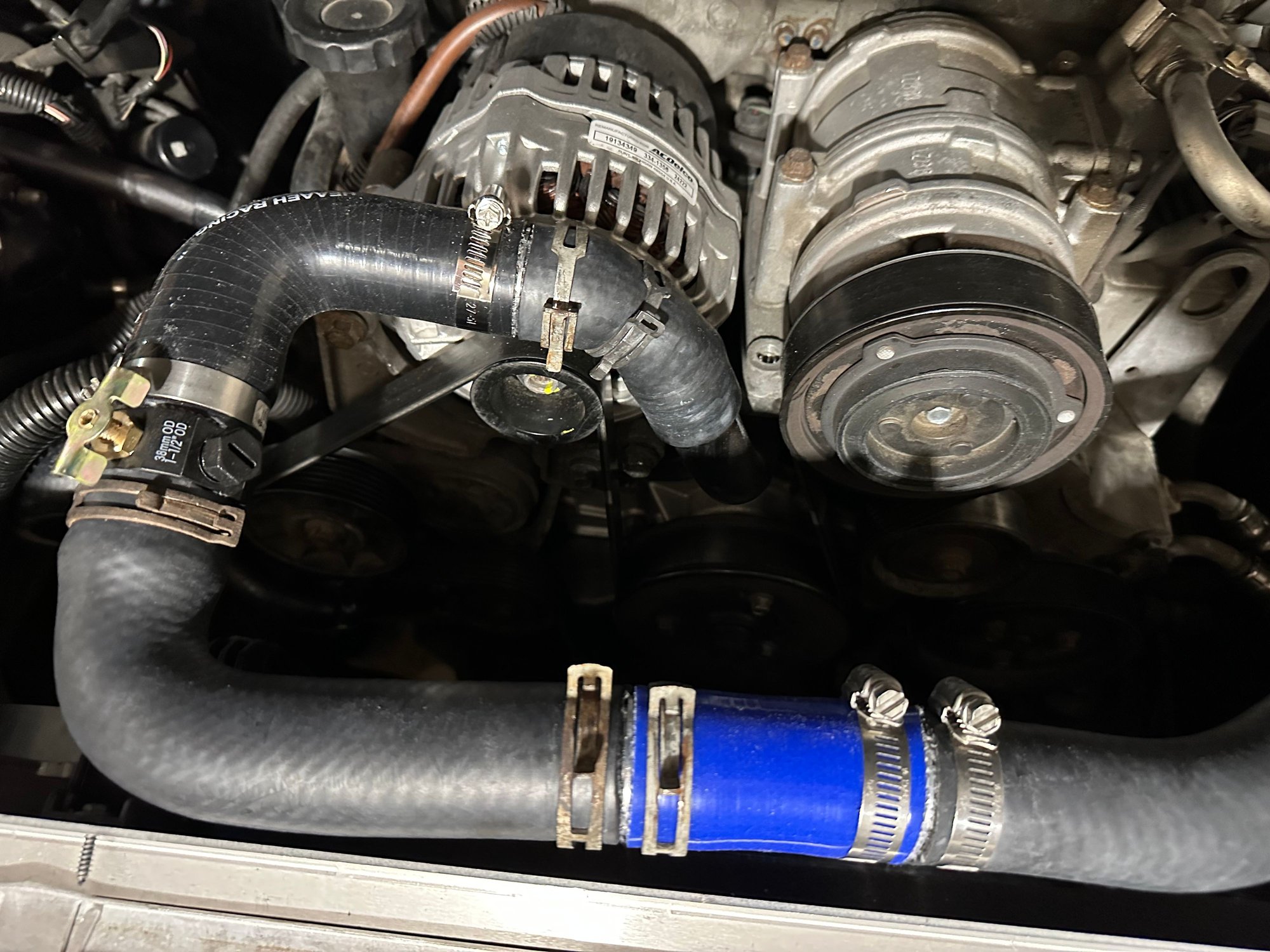 Upper radiator hose view - Temp sensor not installed. I got rid of the bleed valve pictured.