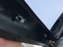 Notice that the flat part of the clip is pointing away from the truck. It should be pointing inward so the clip will slide inward and click in, otherwise you're likely to break the fragile plastic molding that holds the clip.  