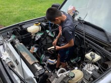 My buddy prepping the engine compartment for cleaning