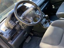 Inside looks brand new. She had seat covers on all the seats from when she purchased the car brand new. 