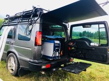 Fridge/Freezer on a slide carrier. My spring loaded sunshade.