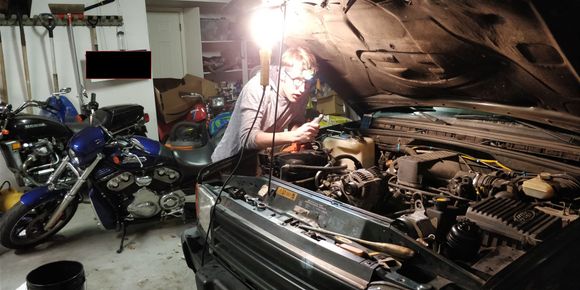 The boy getting his hands dirty.