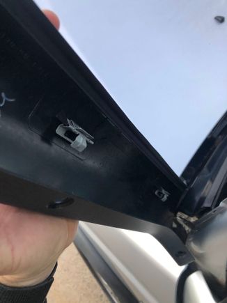 Notice that the flat part of the clip is pointing away from the truck. It should be pointing inward so the clip will slide inward and click in, otherwise you're likely to break the fragile plastic molding that holds the clip.  