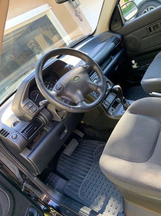 Inside looks brand new. She had seat covers on all the seats from when she purchased the car brand new. 