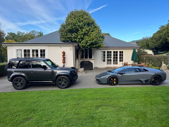 My V8. Roof rails and 20” wheels as I intend to occasionally take it off road. Had it for a few months now - Great vehicle - love it! The speed bump in front of it belongs to a  friend. His V12 is faster than my V8 but I still prefer mine!