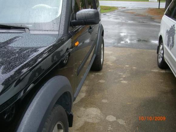 Side shot showing rear wheel with 1.30&quot; spacer behind it.

Wife's Toyota Sienna XLE minivan on the right. The Dragon Lady.  Another story, another time.