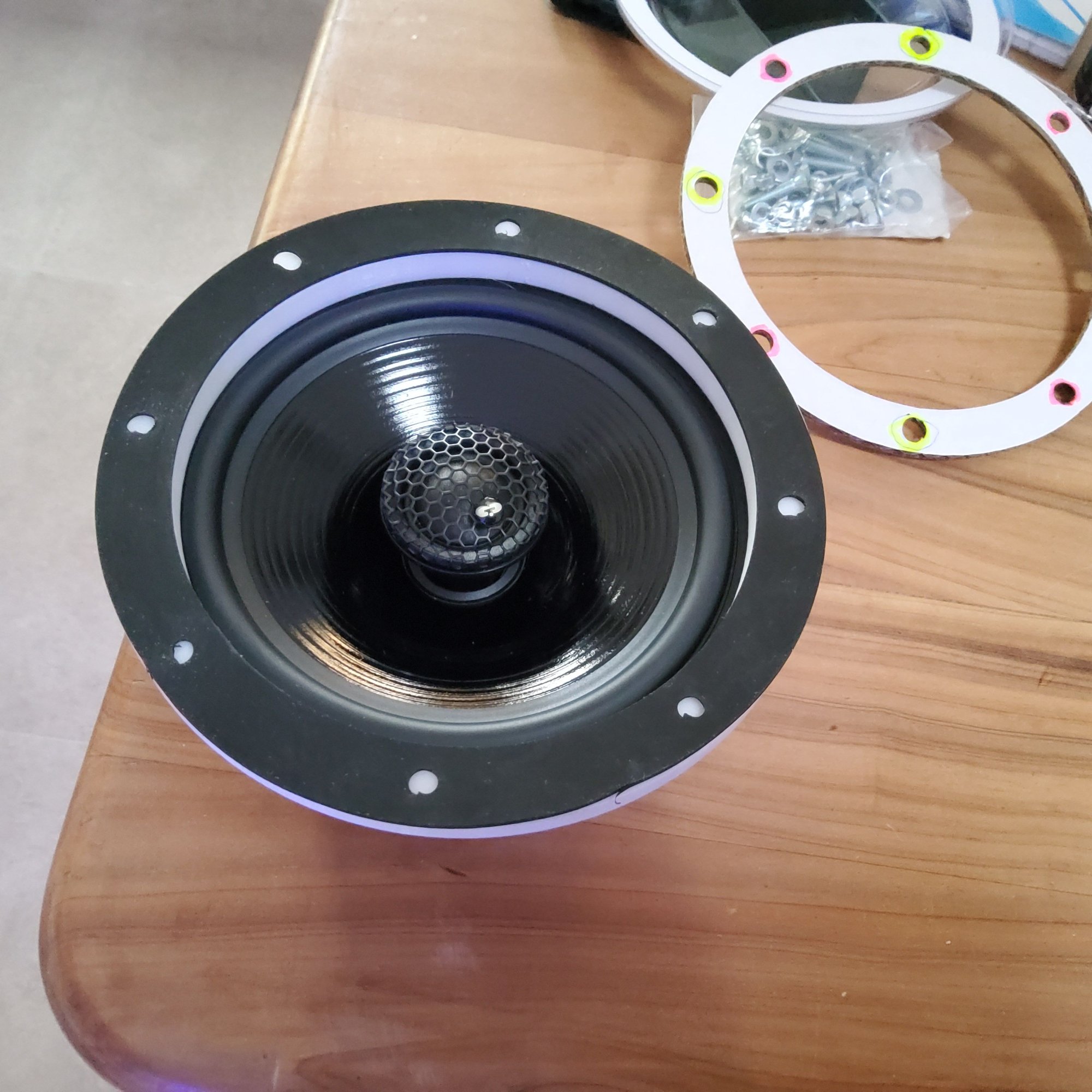 A rubber gasket isolates the speaker.