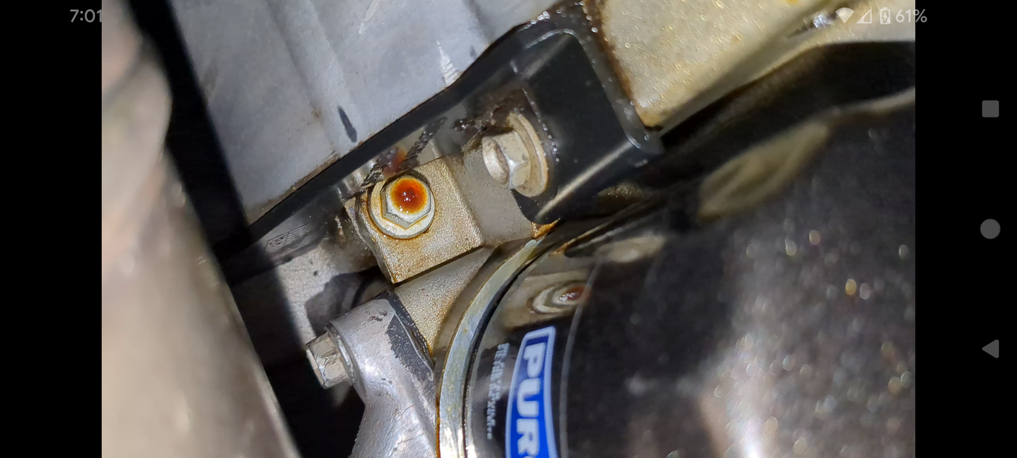 Driver's side rear corner of pan.