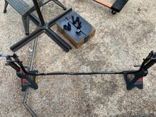 Here is the rear anti-sway bar and painted front anti-sway bar brackets.  I put long bolts through the mounting holes of the anti-sway bars.  I was able to rest the bolts on top of the jackstands and that way I could paint all around the bars and not have to lay the painted bars down and mar the finish.