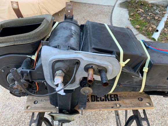 The oversized zip ties are from when I took the box apart back in the 2008 time frame to replace a leaking air conditioning evaporator.  At the time, I also replaced the heater core.  I was going to replace both of those parts again just because I had the entire box out of the car but all the parts are now china made.  The parts inside are old but not china.  I decided to stay with the older, non-china parts.