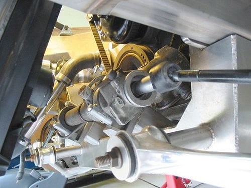 Avanti with ZF rack and pinion mounts fabricated. As seen from beneath the the left front of the car, looking rearward to the front crossmember. The rack is mounted in the Avanti frame in a similar location as the rack on a C4 Corvette.