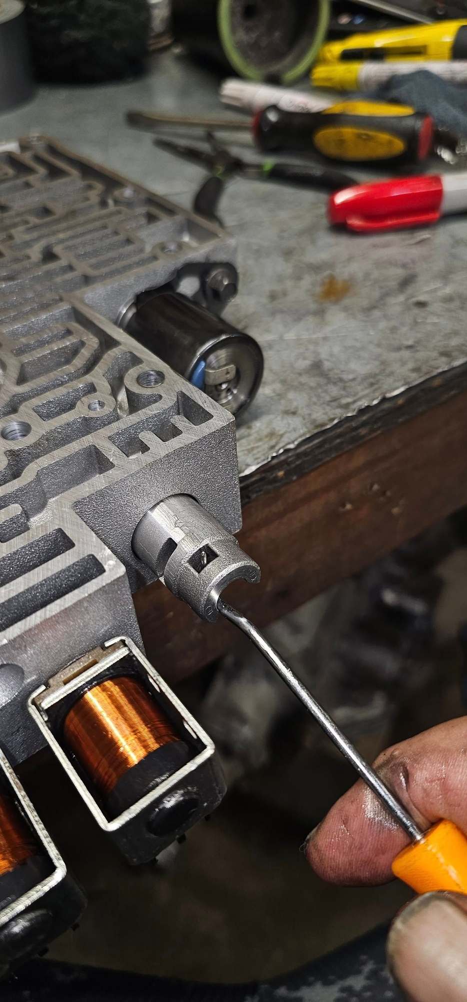 Remove roll pin for accum with flat head through the bore end and then use hooked pick to pull accum out, (note if stuck or really ahrd to remove skip this step its no worth damaging body over )