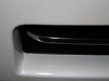 Chrome strip closeup. Attached via peel-off automotive adhesive backing.