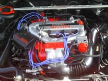 I painted the engine conpartment in satin black to make it look better,i also painted the valve cover,some lettering,throttle body,and strut bar bracket Hugger Orange to match,on the aluminun where it said v6 3.0,i painted black,bought a enblem nismo and install it.also paint intake manifold aluminum silver then clear coated all.since i had to remove the top. I decided to change gasket on all remove parts.Lots of work !