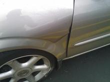 Fender dented in from the front tire being slammed into it.