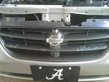 Grille before being repainted. Notice the jacked up paint and half-arse touch up job.