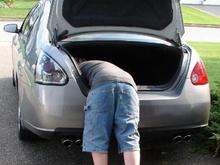 Don't drop the nut waaaaay down in the trunk well like junior here!