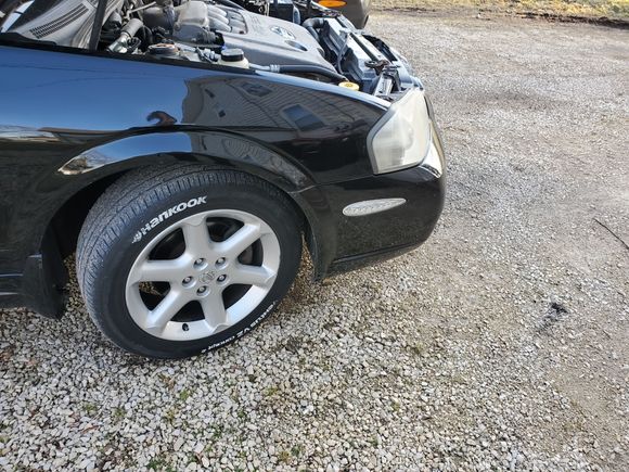 LED side markers all around. White paint marker does wonders to make white letter tires. Looks so much better on a black car. 