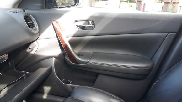 Picture showing passenger side and opened glove compartment.