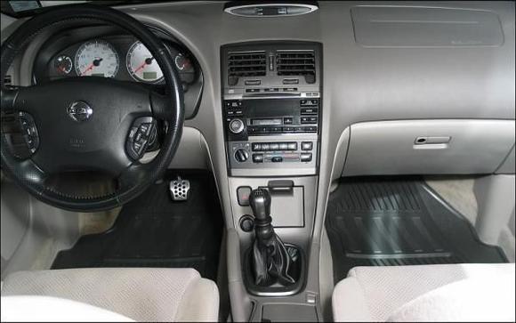Note the OEM Rubber Floor-mats, which I think look much, MUCH better than the cloth mats. They were bought in Fall 2009, and just in the nick of time, because the manufacturer went out of business and the Nissan parts line dried up.

Love these mats.
