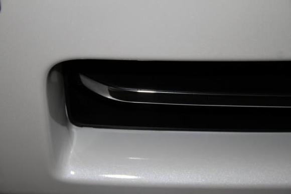 Chrome strip closeup. Attached via peel-off automotive adhesive backing.