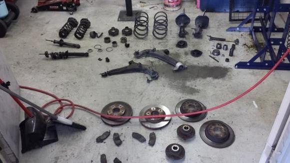 These are all of the factory components that were removed.
Literally EVERYTHING. 

-Entire Suspension Upgrade:

-Tokico Illumina Adjustable struts.
-Tein H-Tech drop springs.
-Timken wheel hub (x4)
-Timken wheel bearing (x4)
-PowerStop ceramic brakes.
-PowerStop Drilled/Slotted rotors.
-OEM stabilizer bar (x2)
-OEM control arm (x2)
-MOOG ball joint (x2)
-OEM inner/outer tie rod (x2)
-KYB strut mounts (x4)
-OEM bumpstops.
-OEM motor mount (x4)
-Megan front strut bar.
-Energy Suspension Polyurethane Sub-frame kit
-Energy Suspension Polyurethane tie rod kit
-Energy Suspension Polyurethane control arm kit
-20mm rear wheel spacers

(Probably more that I'm forgetting)