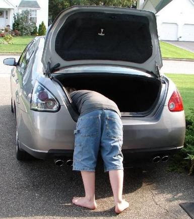 Don't drop the nut waaaaay down in the trunk well like junior here!