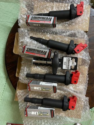 The set of 4 Ignition coils and 4 spark plugs and the puller tool