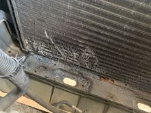 It’s out! But not without damage to the AC condenser. 