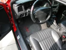 Interior with signature embroidered floor mats