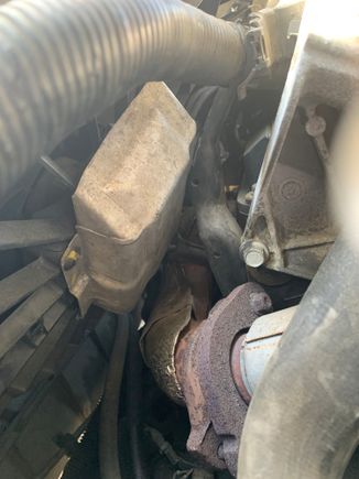 Metal Protector on fan rubbing against engine piece would not allow radiator and fan to come out. 