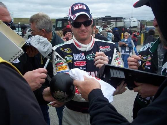Dale Jr Signing out Dash Piece.
