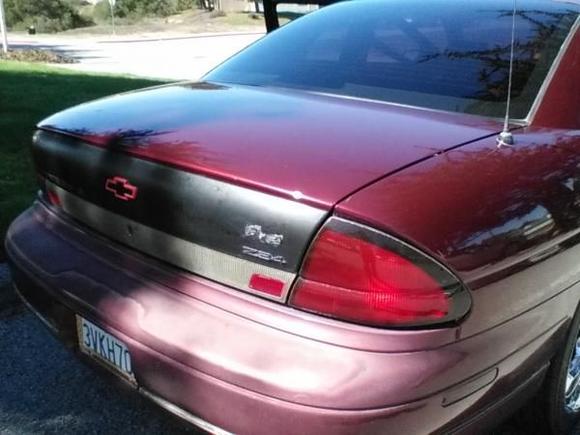 I want to eventually repaint the rear bumper and get that trunk panel to a glossy black. Intend on replacing the emblems with Chrome and tinting down the tail lights.