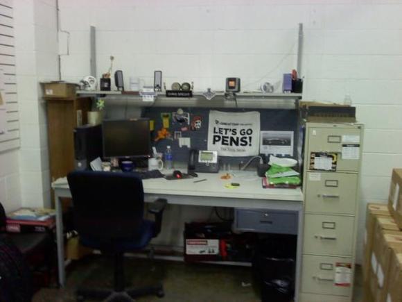 work desk pic, notice the floorjack and stands under the desk and the air compressor to the left! no room to store them at home......